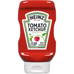 Heinz Tomato Ketchup bottle with red cap and label, placed on a grocery store shelf.