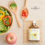 Bottle of Komori Salad Dressing Yuzu with label visible, showcasing a Japanese citrus-flavored dressing in a clear container.