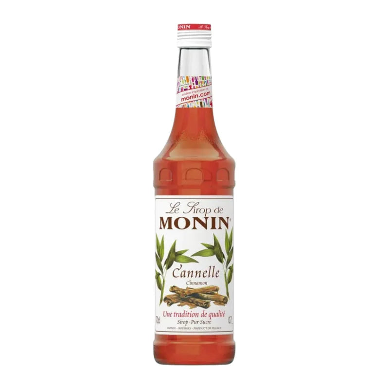 Bottle of MONIN Cinnamon Syrup 700ml for dry grocery, showing the label and dark cinnamon-colored liquid inside the bottle.