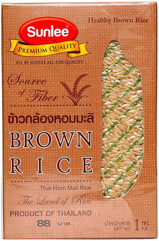 Sunlee brown rice in a clear grocery bag, showing light brown grains with a natural, unpolished appearance.