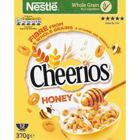 Bowl of Nestle Cheerios Honey cereal with honey-flavored oat rings on a white background
