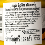 Jar of Masterfoods Hot English Mustard with bright yellow label, showcasing spicy mustard condiment in a grocery setting
