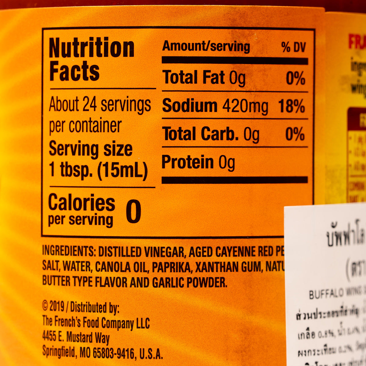Bottle of Frank's Buffalo Wing Sauce, spicy and tangy hot sauce in a clear plastic bottle with orange label.