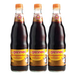Three bottles of Golden Mountain Sauce Brown, 600ml each, in a dry grocery setting, showcasing the product packaging and labels.