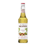 Bottle of MONIN Hazelnut Syrup in 700ml size, used for flavoring coffee and desserts in dry grocery collections.