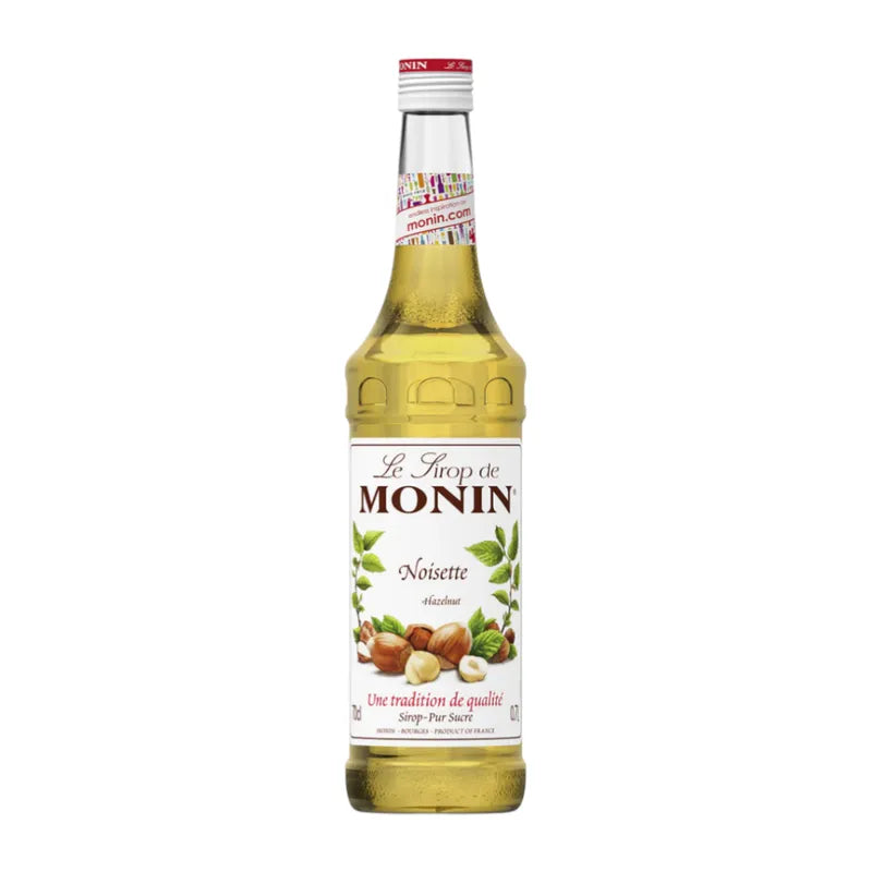 Bottle of MONIN Hazelnut Syrup in 700ml size, used for flavoring coffee and desserts in dry grocery collections.