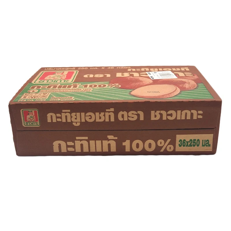 Cans of CHAOKOH Coconut Milk 250ml, stacked in a box, used for cooking and baking in dry grocery shopping.