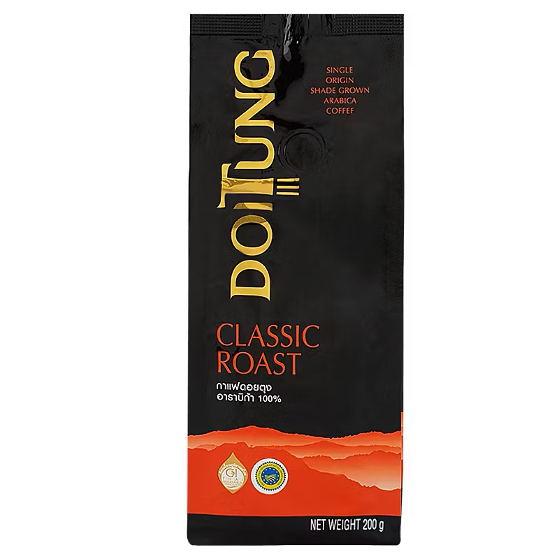 Doi Tung Arabica Coffee Classic Roast drink in a glass with a frothy top, showcasing rich coffee color and inviting aroma.