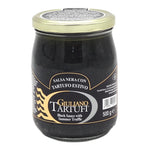 Giuliano Tartufi black truffle sauce jar with label, 500g, in a clear glass container, showing the dark truffle mixture inside
