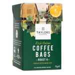 Taylors Rich Italian Roasted Coffee drink in a clear glass cup with a dark, aromatic coffee beverage and frothy top.