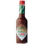 Bottle of Tabasco Chipotle Pepper Sauce showing the label and orange-colored sauce inside the clear glass bottle.