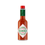Bottle of Tabasco Sauce with a red cap and label, showcasing the iconic hot sauce brand in a grocery setting.