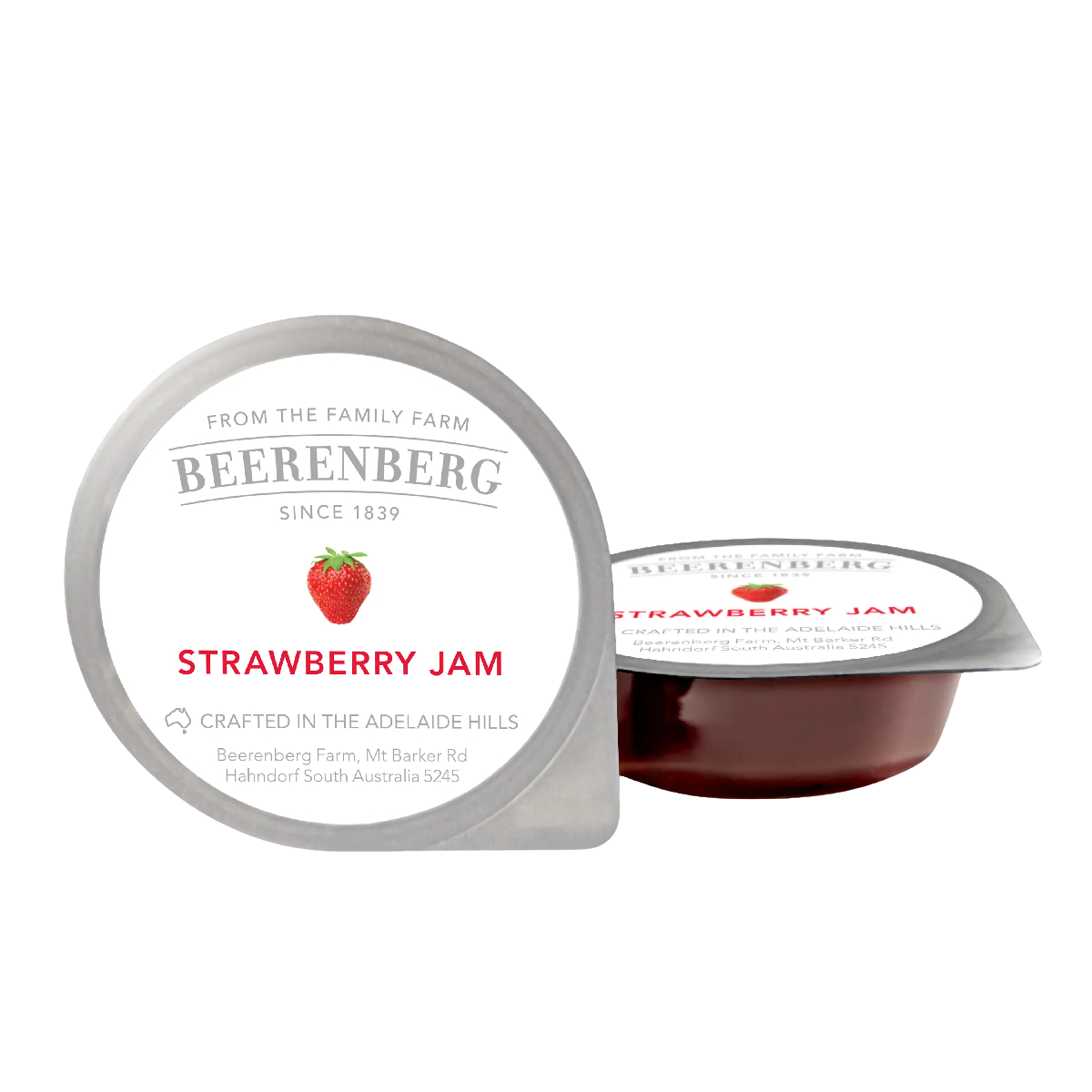 Jar of Beerenberg Strawberry Jam with fresh strawberries and jam spread on toast, showcasing the grocery product.