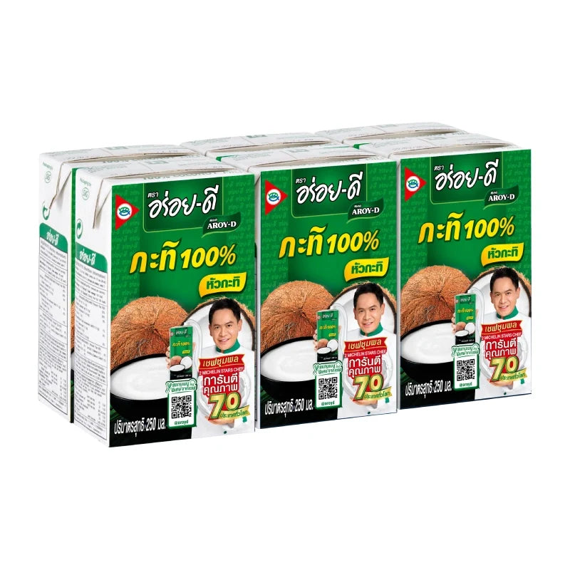 Aroy-D coconut milk bottles, 250ml each, stacked in a pack of six for use in cooking and baking.