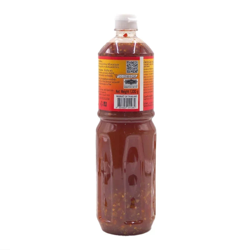 A jar of ARO Thai Spicy Salad Sauce 1.2kg, a dry grocery condiment with vibrant red chili and spice ingredients visible in the image.