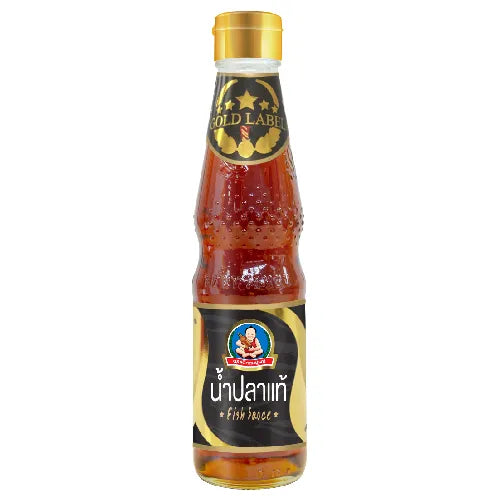 Deksomboon Fish Sauce Gold Label 300ml bottle, traditional Thai dry grocery condiment with rich flavor and clear liquid appearance.