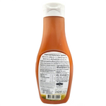 Doi Kham Chili Sauce No Sugar in a glass bottle, showcasing vibrant red chili sauce with a label and cap.