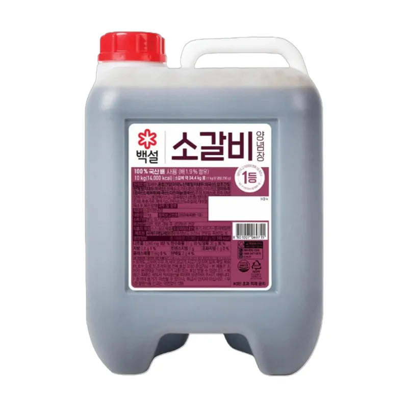 Beksul Galbi Sauce 10kg jar, savory Korean-style marinade, perfect for grilling beef ribs, in a large dry grocery container.