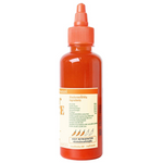 Bottle of Godfather Hot Sauce Original with vibrant label, showcasing spicy condiment for grocery and cooking use.