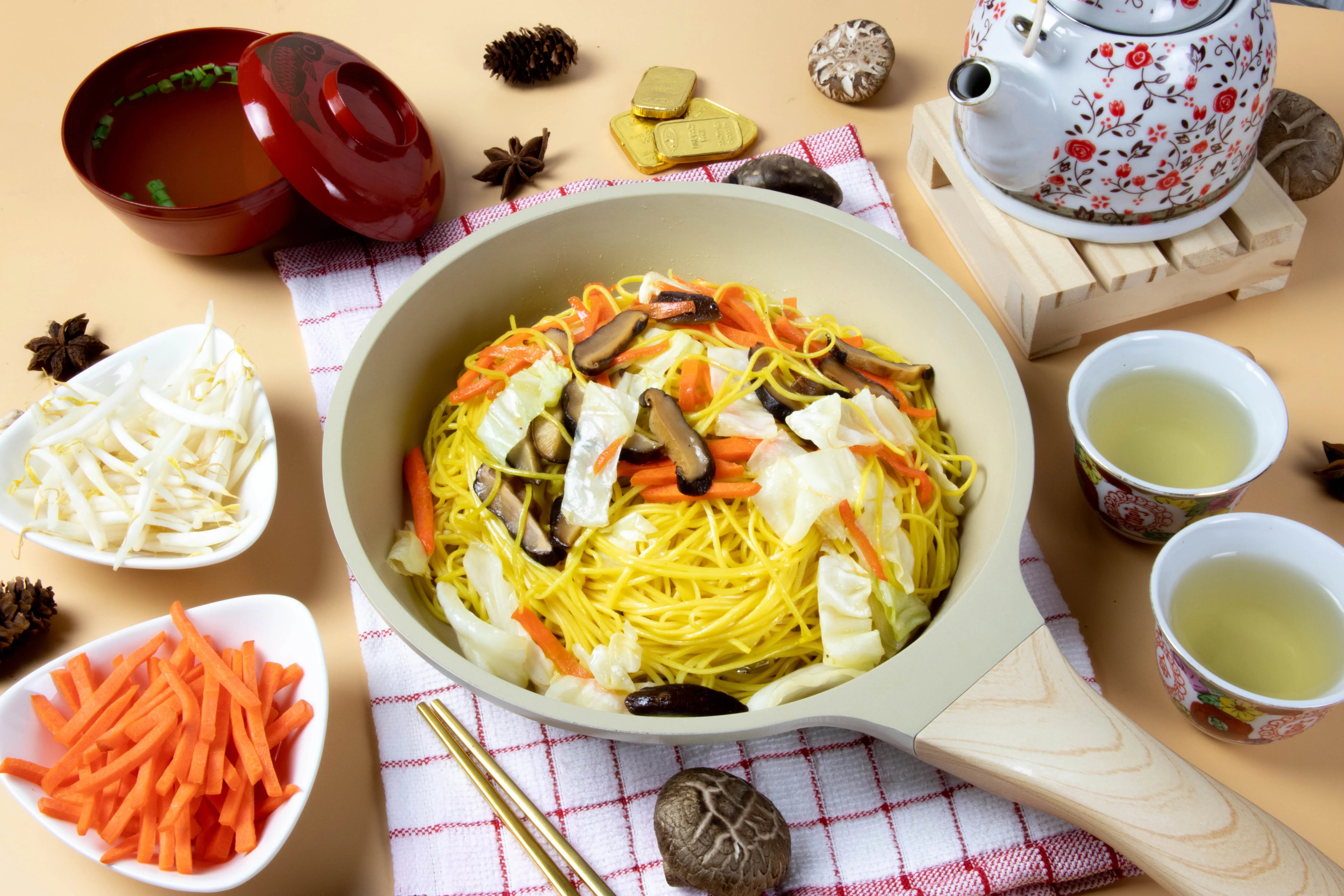 Dry grocery image of Rabbit Brand yellow Chinese noodles, 1kg package, showcasing the bright yellow noodles in a clear view.