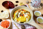 Dry grocery image of Rabbit Brand yellow Chinese noodles, 1kg package, showcasing the bright yellow noodles in a clear view.
