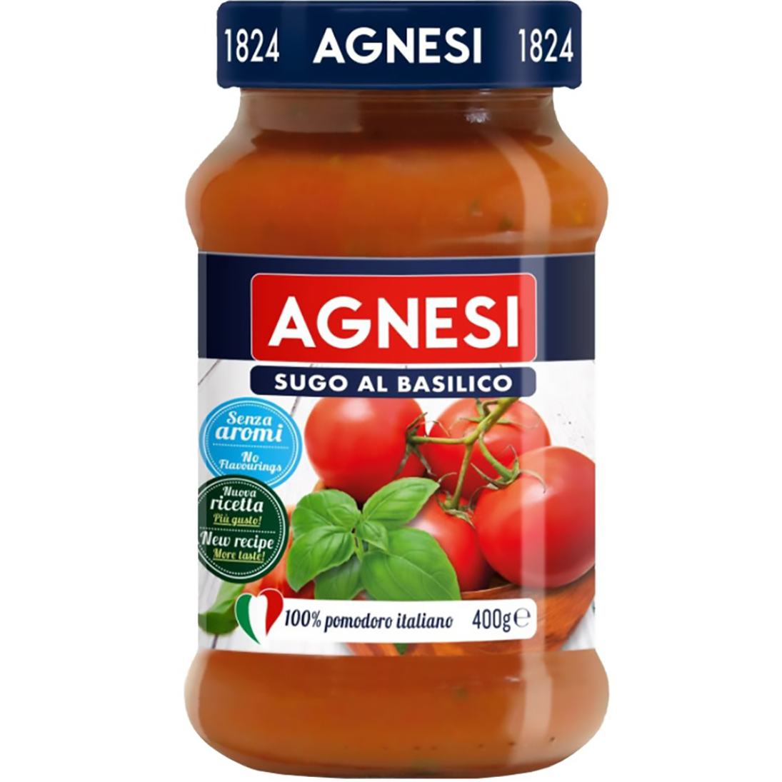 Jar of Agnesi Basilico Tomato Sauce showing label with basil and tomato ingredients on a grocery shelf.