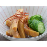Dried Keihin seasoned ajitsuke menma bamboo shoot in a clear container, showcasing the thick, flavorful bamboo shoots for Asian cooking.