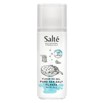 Salte Pure Sea Salt Flakes in a clear container, showcasing delicate, flaky salt crystals for gourmet cooking and seasoning.
