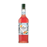 Giffard Mixology Pink Grapefruit 1L bottle of flavored syrup for cocktails and drinks, with pink grapefruit flavor in a clear plastic bottle.
