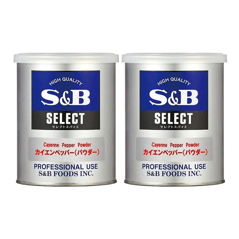 S & B Cayenne Pepper Powder cans, 200g each, shown with red cayenne pepper powder inside clear cans, in a dry grocery setting.