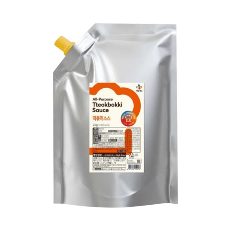 CJ Tteokbokki Sauce 2kg jar, dry grocery product with rich, red Korean spicy sauce for tteokbokki and Asian dishes.