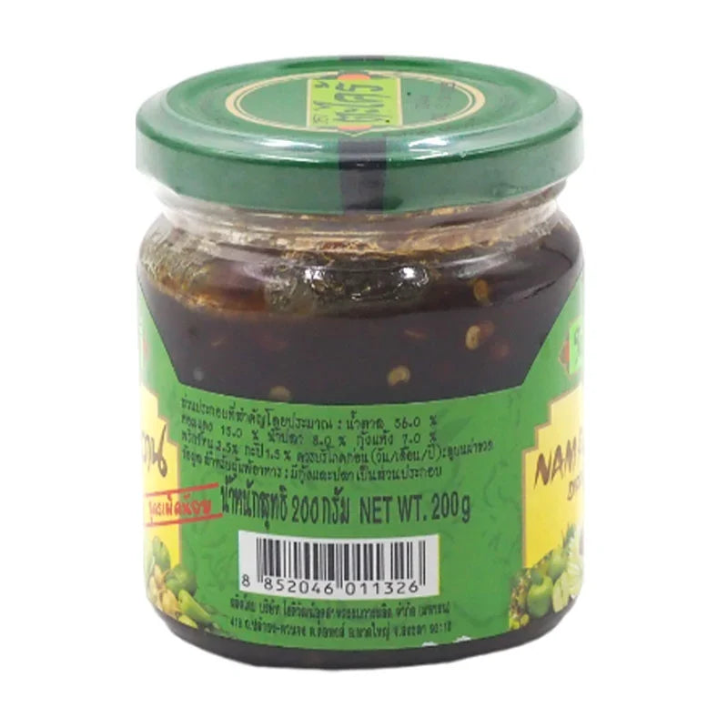 TA Krai Mango Dipping 200g in a clear jar, showcasing dried mango slices for use in snacks and cooking.
