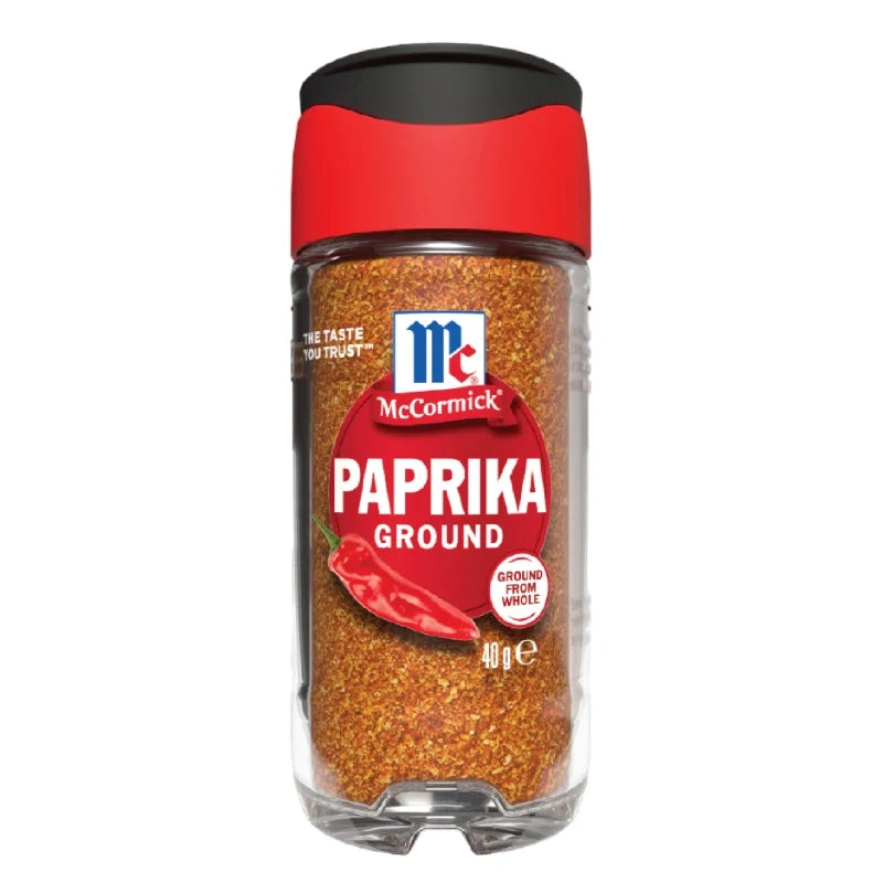 Mccormick Paprika Powder in 40g container, bright red spice in clear jar, used for adding flavor and color to dishes.