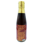 Bottle of Roi Thai Tamarind Sauce for cooking and flavoring, with a label showing tamarind fruit and Thai cuisine ingredients.