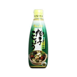 S & B Yuzu Kosho sauce in a bottle, featuring Japanese and green chili peppers, for use in Asian cuisine and seasoning.