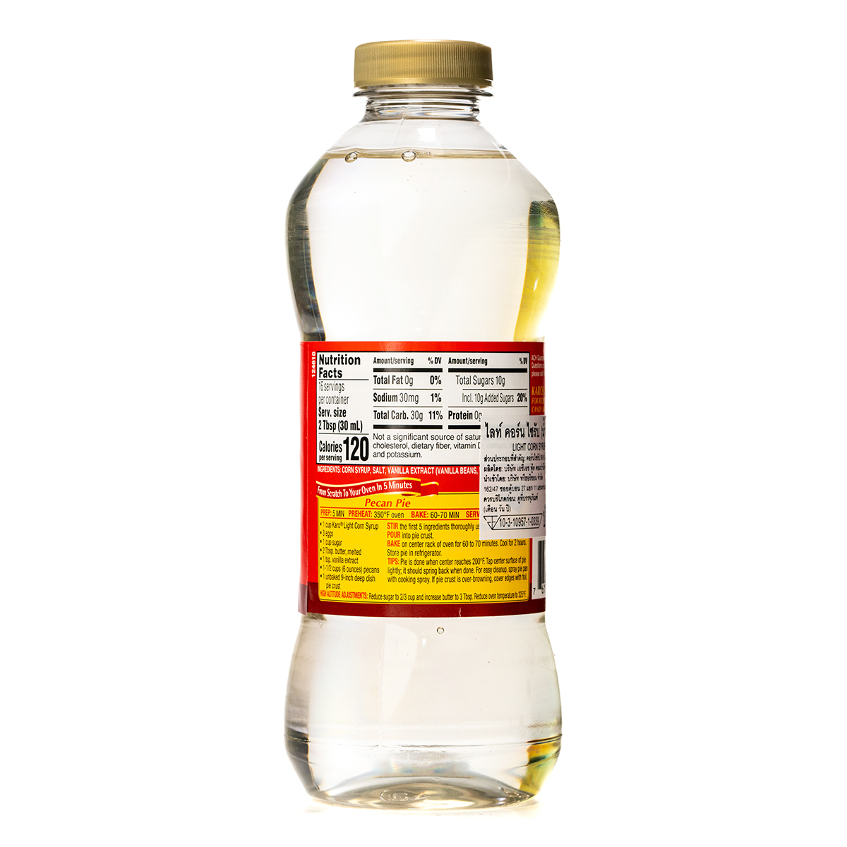 Karo Light Corn Syrup bottle, a clear glass container with yellow syrup inside, used for baking and cooking.