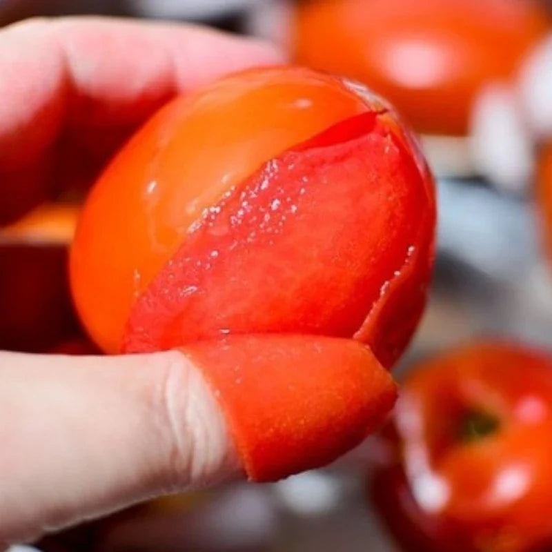 Cans of MICA Whole Peeled Tomatoes in juice, 400g, in a dry grocery store display with tomatoes visible through the can.