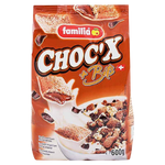 Familia Choc'X + Bits cereal in a bowl with milk, featuring chocolate-flavored cereal pieces and colorful bits, on a white background.