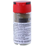 Ground McCormick black pepper in a jar, showing the spice's dark, finely ground texture for seasoning and cooking.