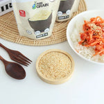 Pure Grain 100% instant roasted white sesame in 80g package, dry grocery product with toasted sesame seeds for cooking and baking.