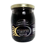 Jar of Giuliano Tartufi black truffle sauce with 5% black truffles, 500g, in a clear glass container on a white background.