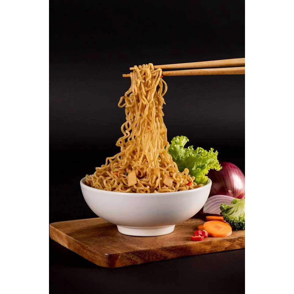 Pack of Domin Mie Fried Instant Noodles with Dumpling, featuring noodles and dumplings in a flavorful Asian-style grocery item.
