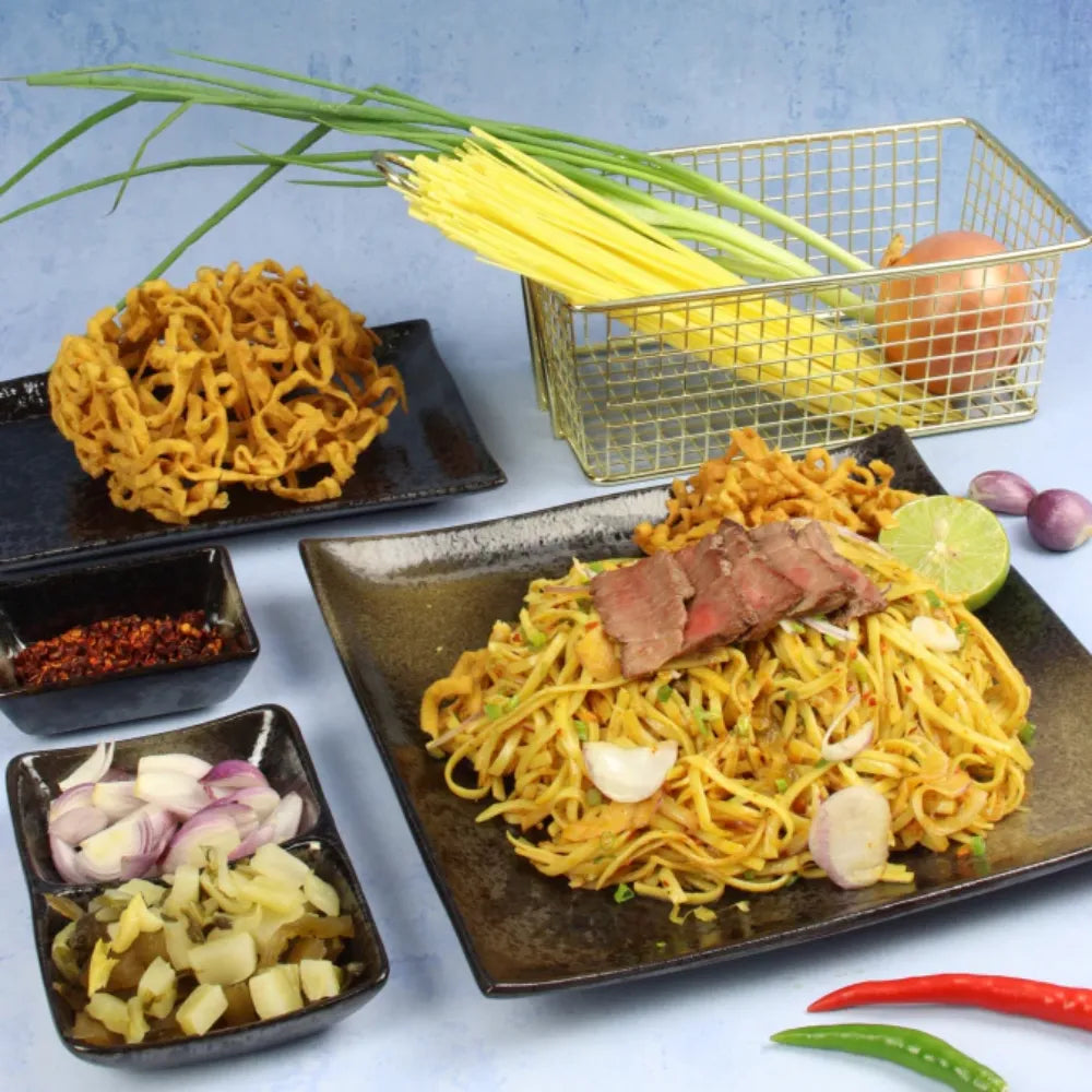 Dry grocery image of Rabbit Brand Khao SOI noodles in a packaging bag, showcasing traditional Thai noodle product.