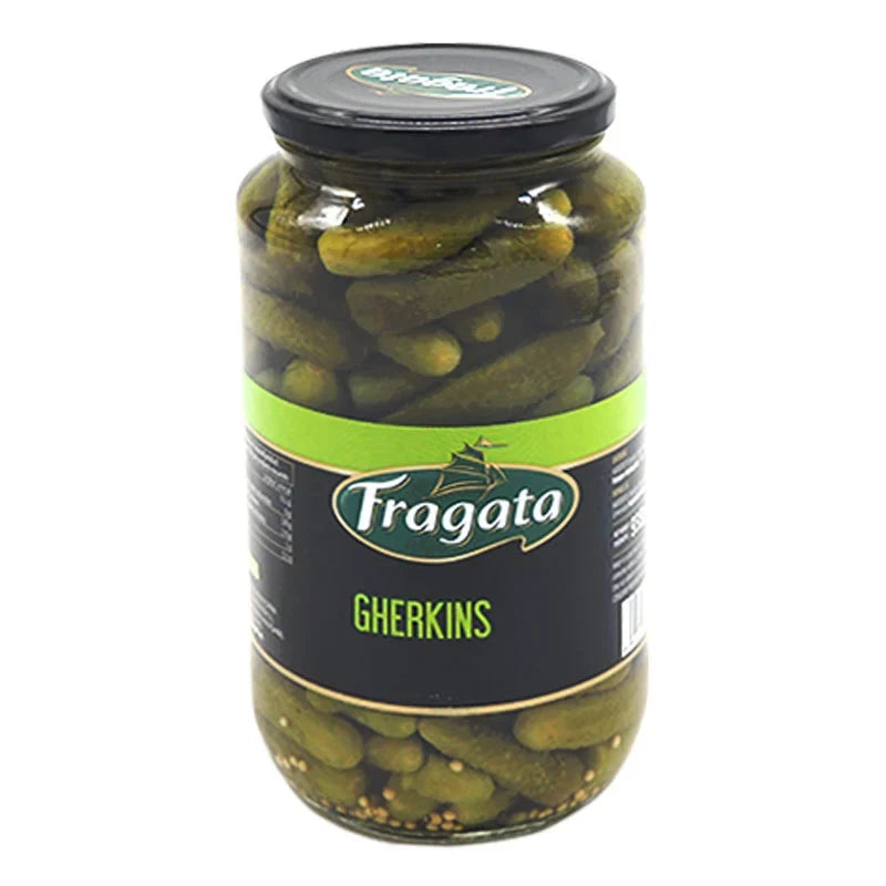 Jar of Fragata Gherkin Pickles in brine, showing fresh, crunchy green gherkins in a clear glass jar for dry grocery shopping.