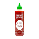 J-LEK Sriracha Hot Chili Sauce 820g bottle with red cap and label, showing spicy chili sauce in a clear plastic bottle.