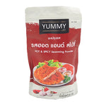 YUMMY Hot & Spicy Seasoning Powder 500g in a clear plastic container, used for adding bold flavor to dishes.
