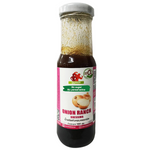 Bottle of Guyvy Healthy Onion Dressing with fresh onions and herbs, ideal for salads and sandwiches.