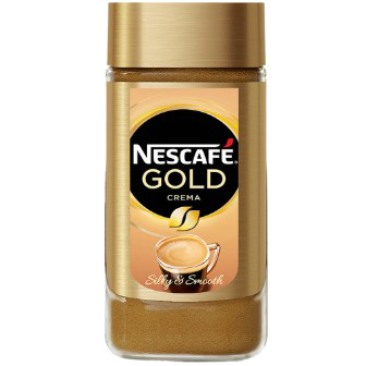 Cup of Nescafe Gold Crema instant coffee in a glass mug with a frothy crema on top, showcasing the rich coffee drink.