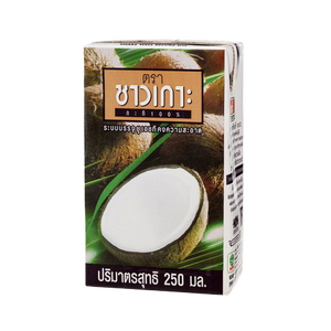 Coconut milk in a can from Chaokoh, creamy Thai grocery product, with a smooth, white liquid visible in the image.