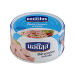 Cans of Nautilus Tuna Chunks in Brine, stacked on a grocery shelf with label details visible.